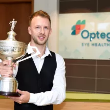 Judd Trump holding trophy at Orega