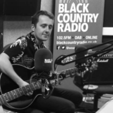 Man playing guitar for Black Country Radio