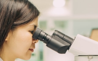 Woman viewing microscope