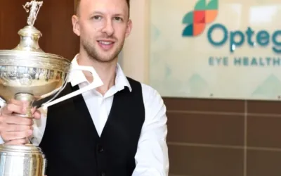 Judd Trump holding trophy at Orega