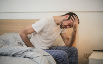 Man holding his head with a headache