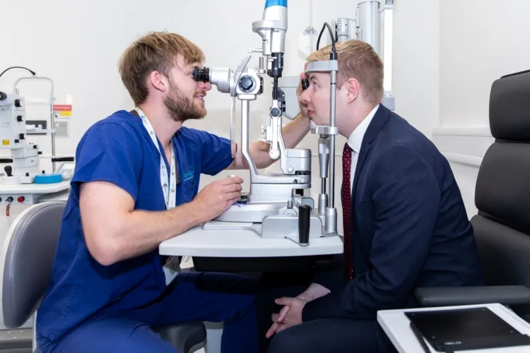 Jacob Collier MP having his eyes checked on his visit to Optegra Eye Clinic Uttoxeter