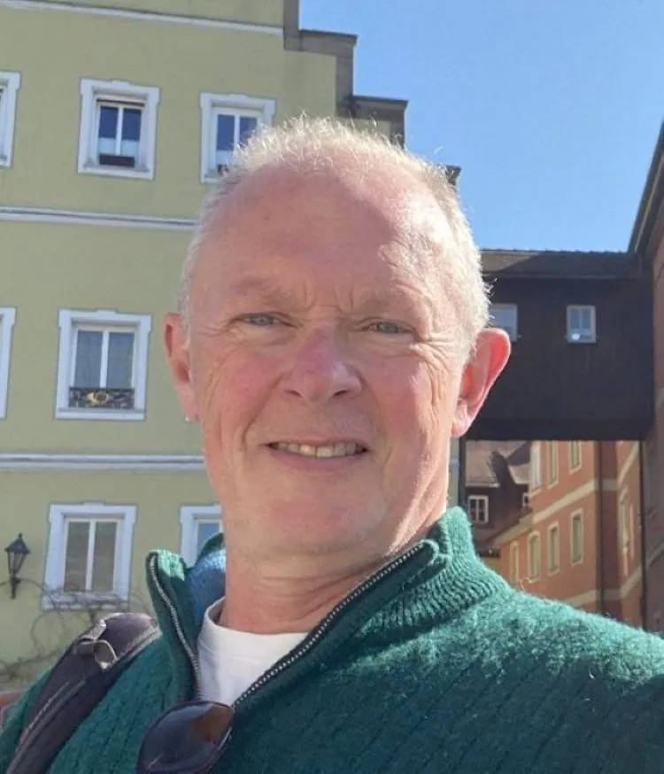 Mark Evans, patient, happy after sight saved by staff and Optegra Central London